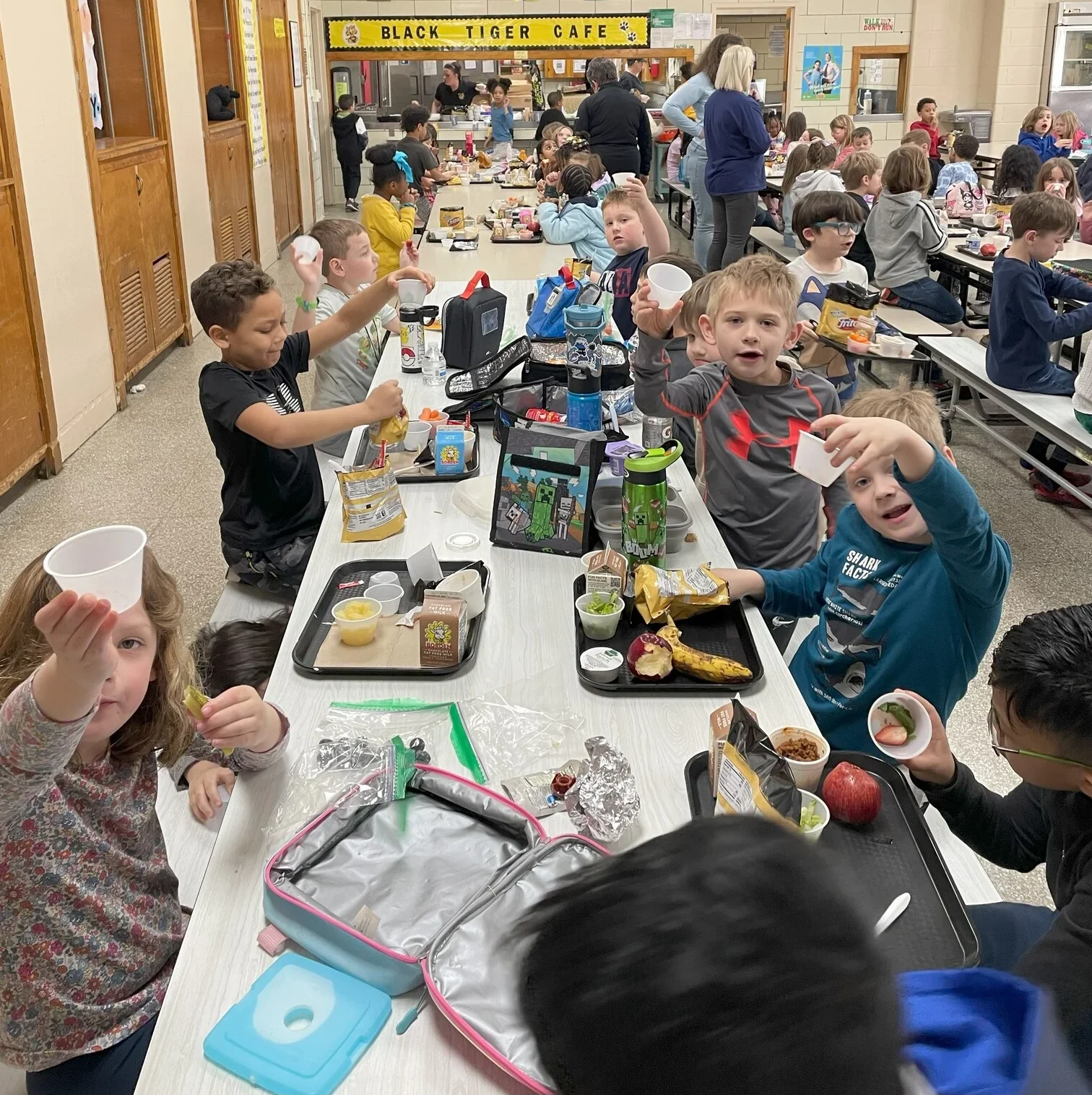 Young students enjoying fresh food at Totally Tasty event