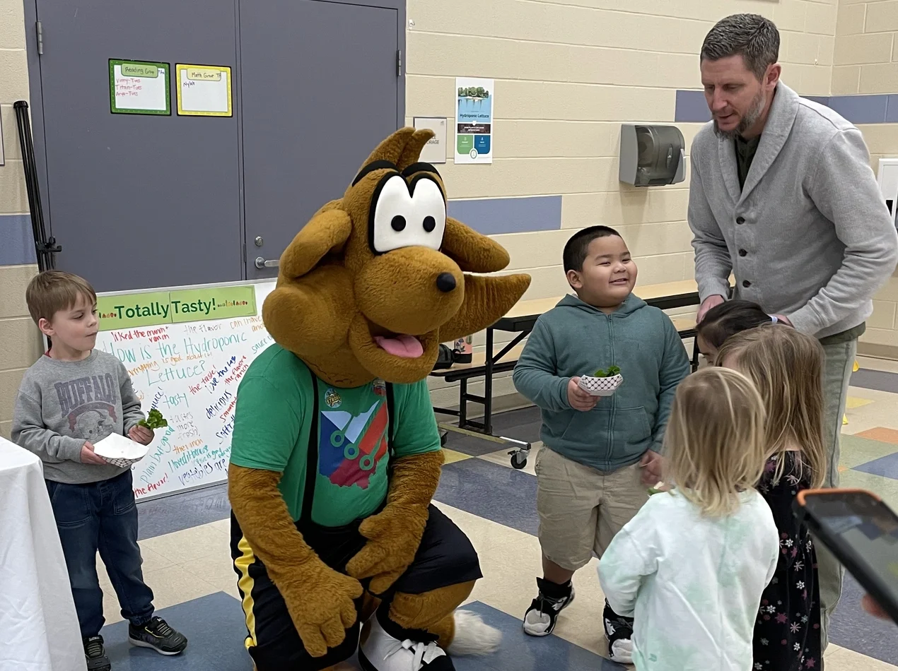 Young students meeting mascot at Tottaly Tasty event